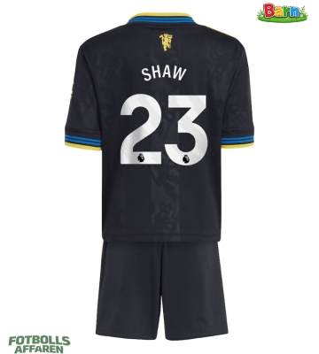 Manchester United Luke Shaw #23 Tredjeställ Barn 2025-26 Kortärmad (+ Korta byxor)